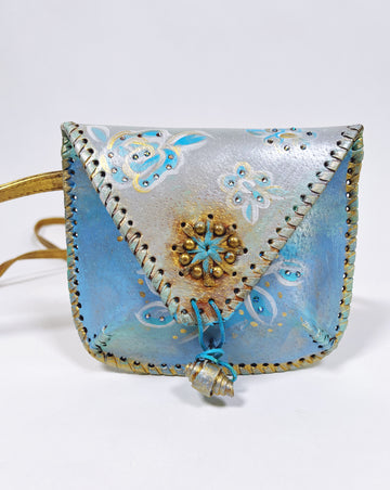 Up cycled, hand-painted real leather crossbody micro bag in ocean blue by Mer Rose Atelier.