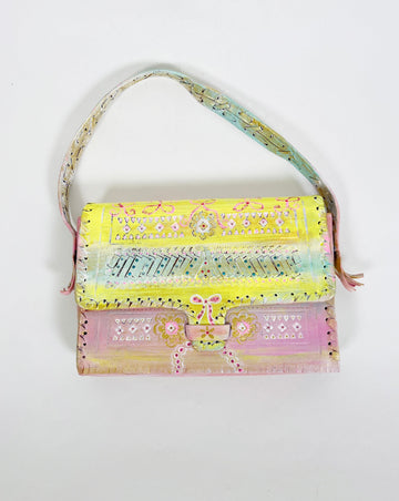 Beautiful hand painted, up-cycled leather handbag in pastel colors with bows by Mer Rose Atelier.