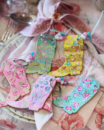 Hand painted, one-of-a-kind cowboy boot leather keychains by Mer Rose Atelier designed by Marla Meridith.