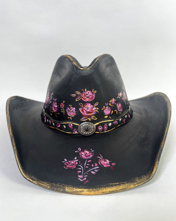Stand out with a custom painted hat. This beauty is covered with elegant, whimsical hand painted, one-of-a-kind roses, buds and metallic gold details.